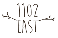 1102 East logo.png
